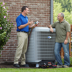 Carrier Heating and Cooling dealer with homeowner outdoors